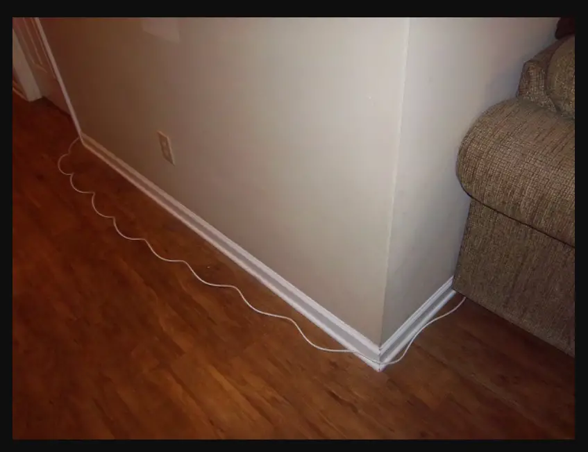 how to hide ethernet cable along wall